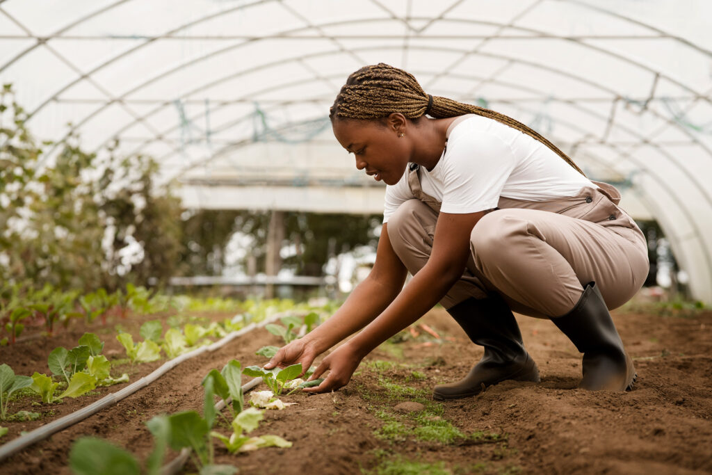 About Us side view woman taking care plants
